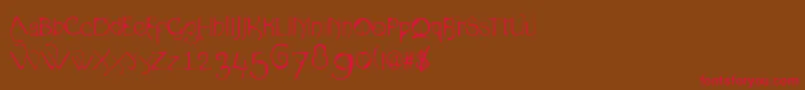 フォントOrganica90 – 赤い文字が茶色の背景にあります。