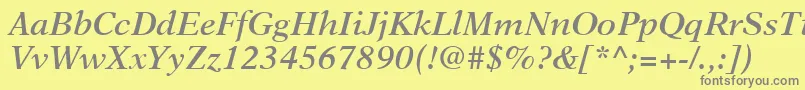 フォントNewAsterLtSemiBoldItalic – 黄色の背景に灰色の文字