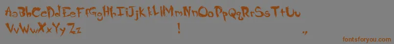 フォントCrappy – 茶色の文字が灰色の背景にあります。