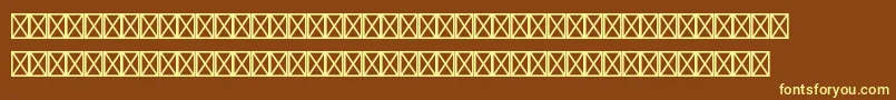 フォントBundesbahnpistd3 – 黄色のフォント、茶色の背景