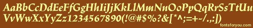 LinotypeTrajanusBlackitalic-fontti – keltaiset fontit ruskealla taustalla