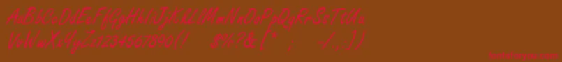 フォントFreestylescript – 赤い文字が茶色の背景にあります。