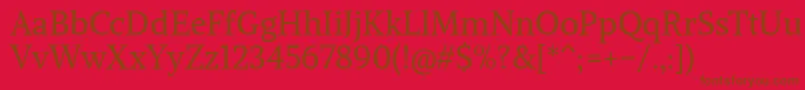 Fonte AlikeangularRegular – fontes marrons em um fundo vermelho