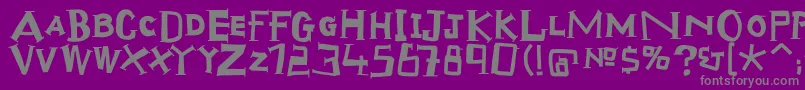 Scraptiqua-fontti – harmaat kirjasimet violetilla taustalla