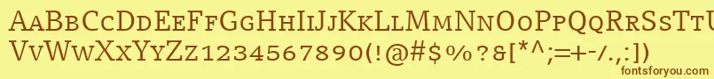 フォントCompatilLetterLtComRegularSmallCaps – 茶色の文字が黄色の背景にあります。