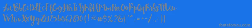 フォントPennellino – 青い背景に灰色の文字