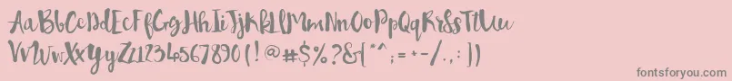 フォントPennellino – ピンクの背景に灰色の文字