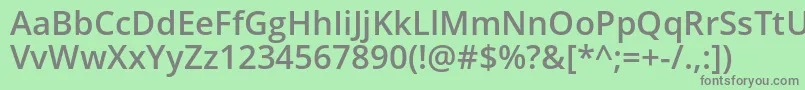 Opensans Semibold-fontti – harmaat kirjasimet vihreällä taustalla
