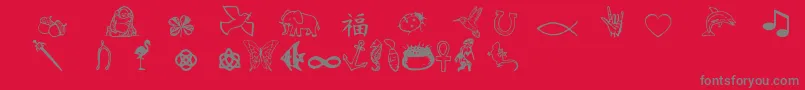 Charmingsymbols-fontti – harmaat kirjasimet punaisella taustalla