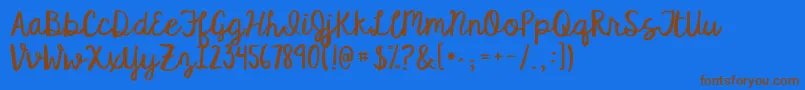 フォントKgsatisfiedscript – 茶色の文字が青い背景にあります。