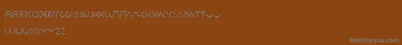 Шрифт Essedicom – серые шрифты на коричневом фоне
