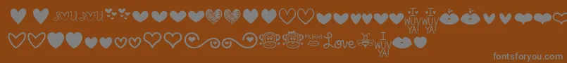 MfLoveDings-Schriftart – Graue Schriften auf braunem Hintergrund