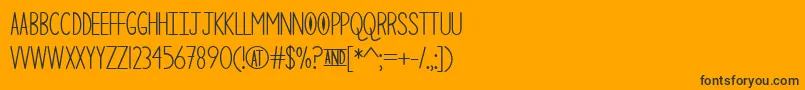 TheCuriousCat Font – Black Fonts on Orange Background