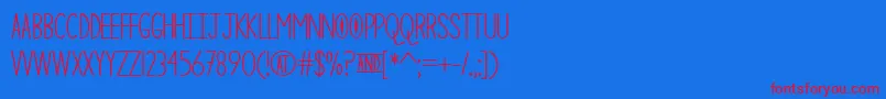 TheCuriousCat-Schriftart – Rote Schriften auf blauem Hintergrund