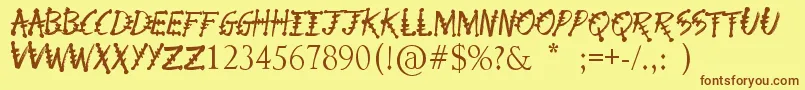 フォントPhysicsTeacher – 茶色の文字が黄色の背景にあります。