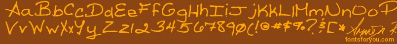 ReedsWriting Font – Orange Fonts on Brown Background