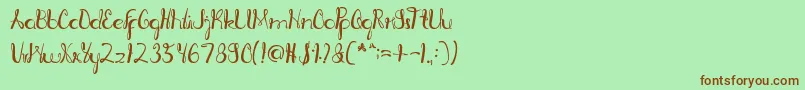 RagatniaClara-Schriftart – Braune Schriften auf grünem Hintergrund