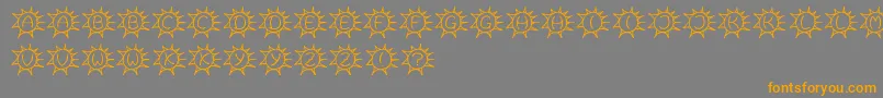 フォントSassys – オレンジの文字は灰色の背景にあります。