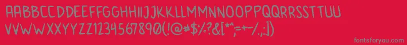 AnimeInept-Schriftart – Graue Schriften auf rotem Hintergrund