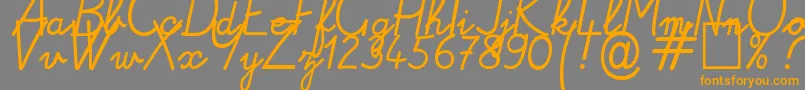 Alamain Font – Orange Fonts on Gray Background