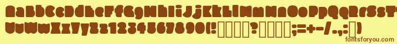SlukoniFat-Schriftart – Braune Schriften auf gelbem Hintergrund