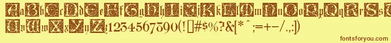 フォントLombardinaInitialTwo – 茶色の文字が黄色の背景にあります。