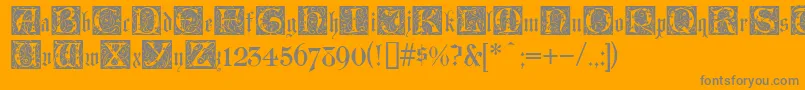 LombardinaInitialTwo-Schriftart – Graue Schriften auf orangefarbenem Hintergrund