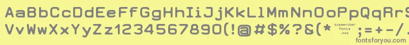 フォントEarth2073 – 黄色の背景に灰色の文字