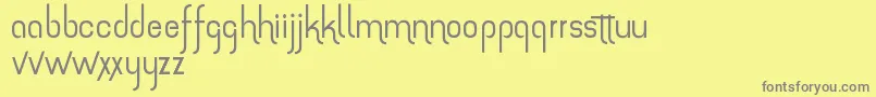 フォントTheAmazingGrace – 黄色の背景に灰色の文字
