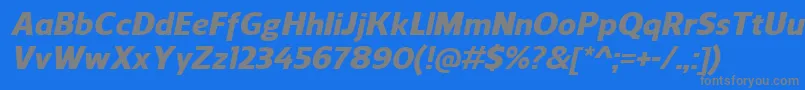 ReganHeavyitalic-fontti – harmaat kirjasimet sinisellä taustalla