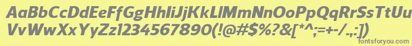 ReganHeavyitalic-fontti – harmaat kirjasimet keltaisella taustalla