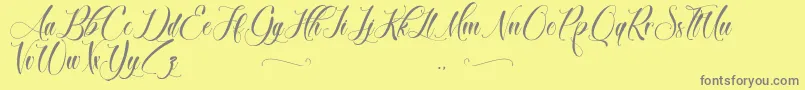 BrokenHeart-Schriftart – Graue Schriften auf gelbem Hintergrund