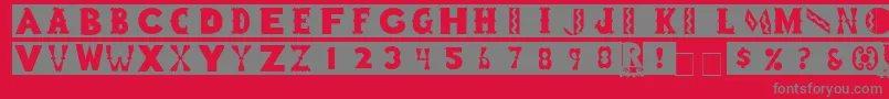ToyBlockMedium-Schriftart – Graue Schriften auf rotem Hintergrund