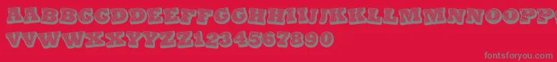 フォントBlackSpiral – 赤い背景に灰色の文字