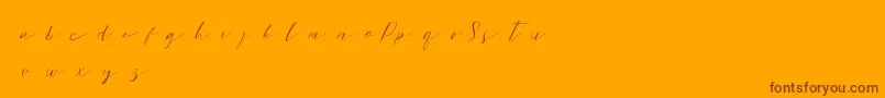 Sweetpattersondemo-Schriftart – Braune Schriften auf orangefarbenem Hintergrund