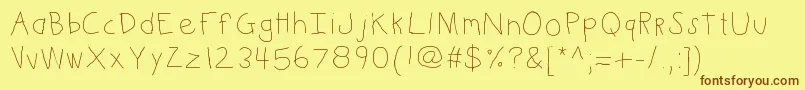Kbkinderwrite Font – Brown Fonts on Yellow Background