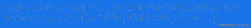 Kbkinderwrite-Schriftart – Graue Schriften auf blauem Hintergrund