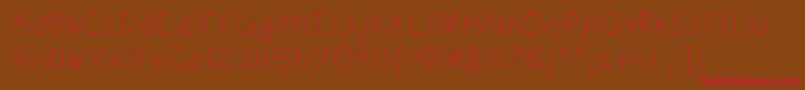 Kbkinderwrite Font – Red Fonts on Brown Background