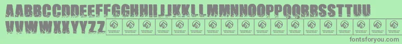 フォントNamesbrutas – 緑の背景に灰色の文字