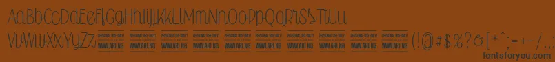 Falkinscriptuprightpersonal Font – Black Fonts on Brown Background
