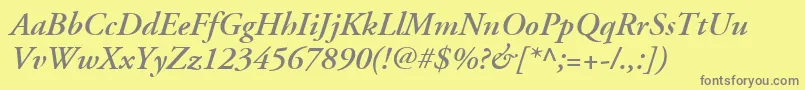 AdobeGaramondLtSemiboldItalic-fontti – harmaat kirjasimet keltaisella taustalla