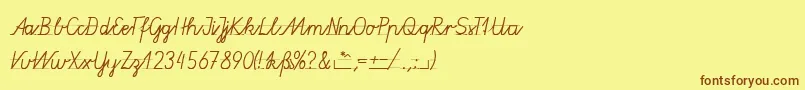 フォントGruenewaldVa3k – 茶色の文字が黄色の背景にあります。