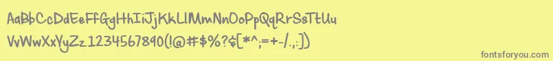 フォントSassyMolassy – 黄色の背景に灰色の文字