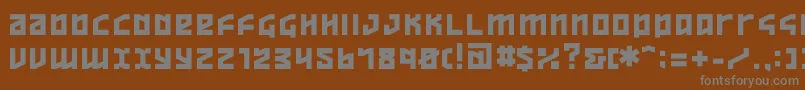 Ov-fontti – harmaat kirjasimet ruskealla taustalla