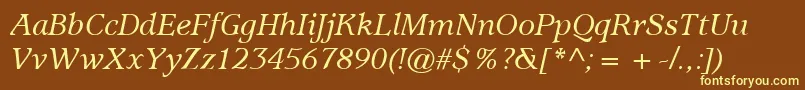 ItcUsherwoodLtMediumItalic-fontti – keltaiset fontit ruskealla taustalla