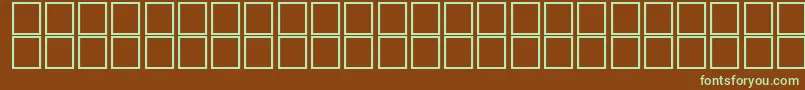 Czcionka McsMamlokyEUNormal. – zielone czcionki na brązowym tle
