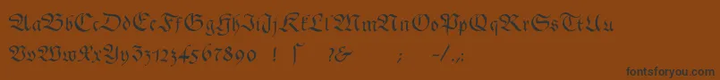 フォントGingkofraktur – 黒い文字が茶色の背景にあります