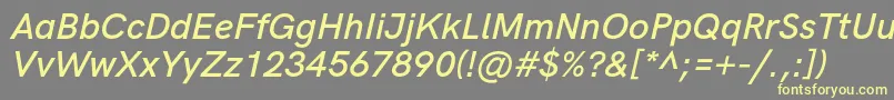 フォントHkgroteskSemiboldlegacyitalic – 黄色のフォント、灰色の背景