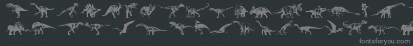 Dinosaurs-fontti – harmaat kirjasimet mustalla taustalla