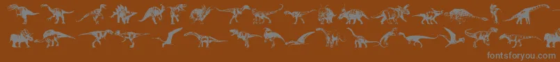 フォントDinosaurs – 茶色の背景に灰色の文字